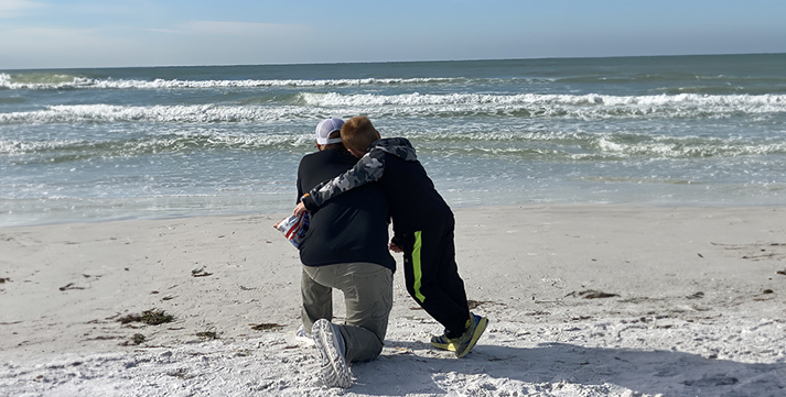 Father and son enjoying Siesta Key beach